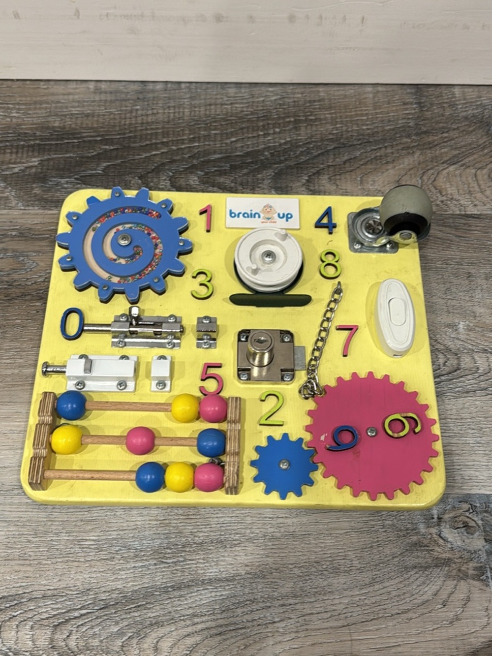 Yellow Sensory Activity Board with Pink & Blue Gears